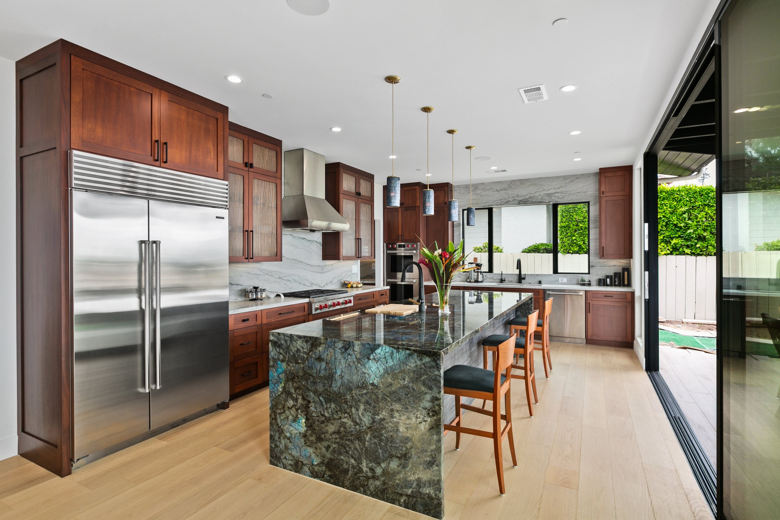 Quartzite fireplaces with mahogany beams, and breathtaking ocean views of La Jolla- commitment to luxury and quality in home development is our hallmark. 